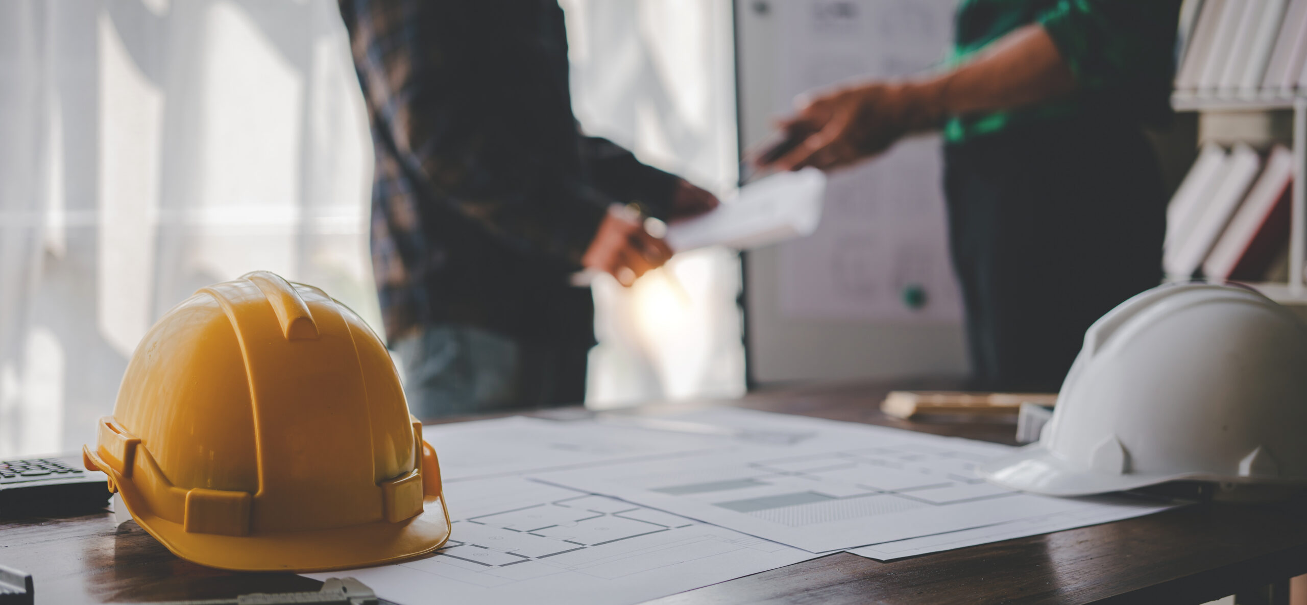 Engineers work as a team with blueprints for architectural plans. Engineer sketching construction project concept with architect equipment Architects talking at table Teamwork and construction concept