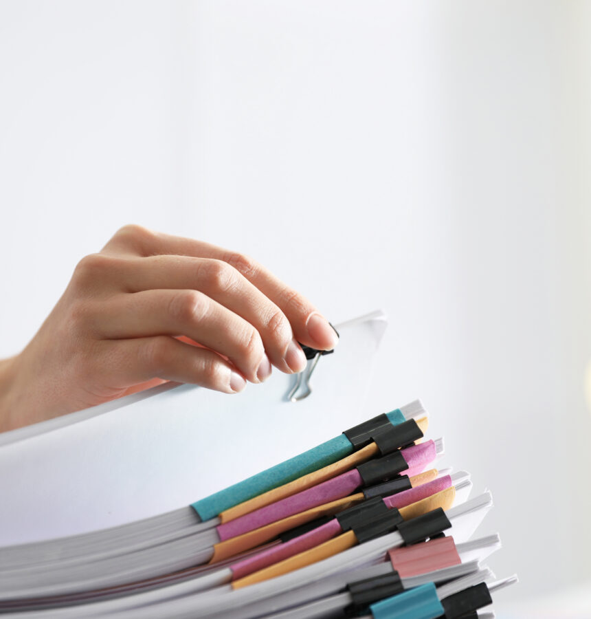 Employee working with documents in office, closeup.
