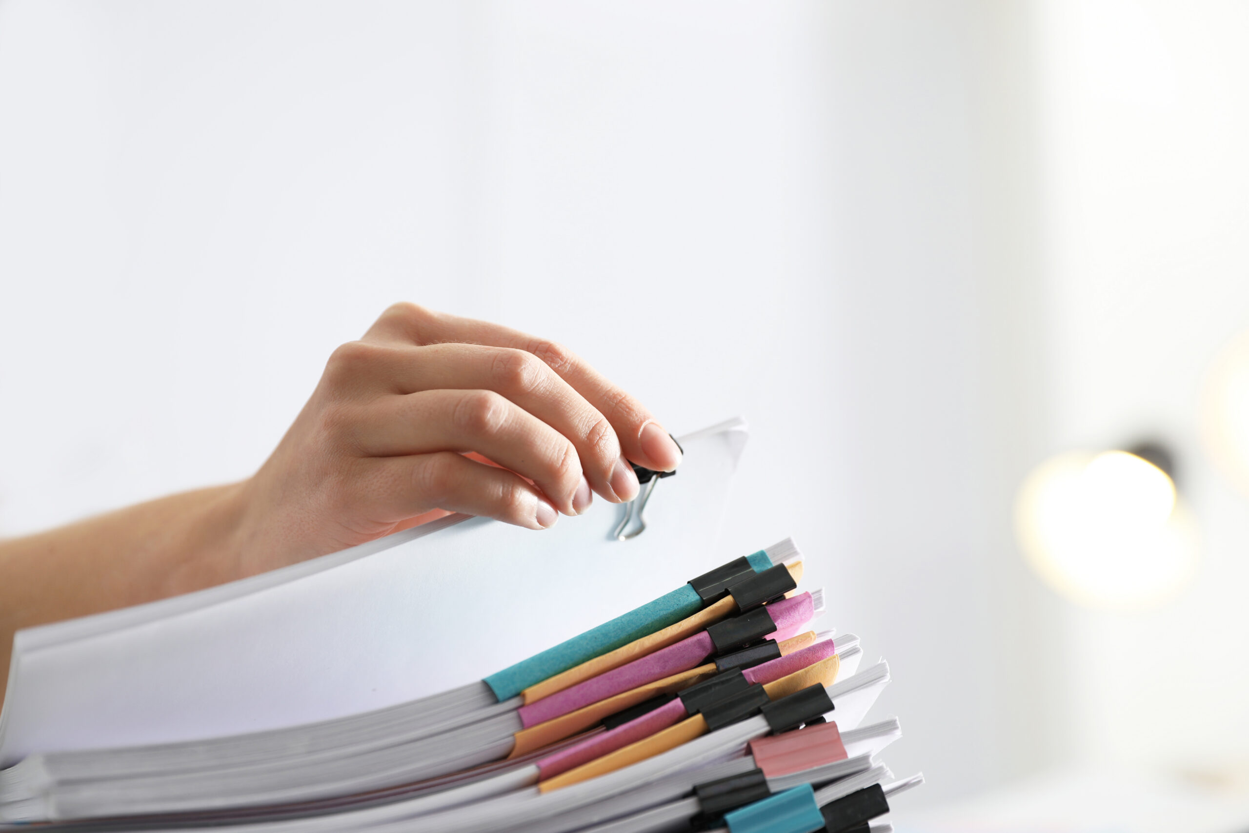 Employee working with documents in office, closeup.